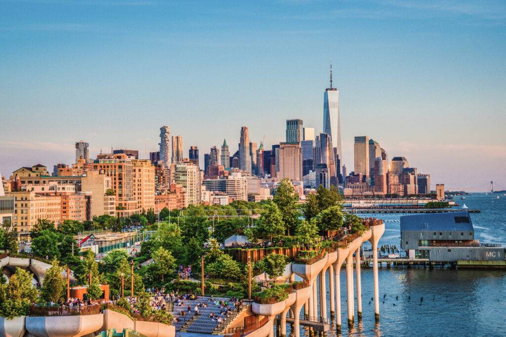 A photograph of Little Island in Chelsea New York. A great public park for walking and relaxing with beautiful views of the Manhattan skyline and Hudson River all around.